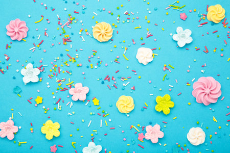 Easter sugar sprinkles for decor cake on blue background. Top viewの写真素材