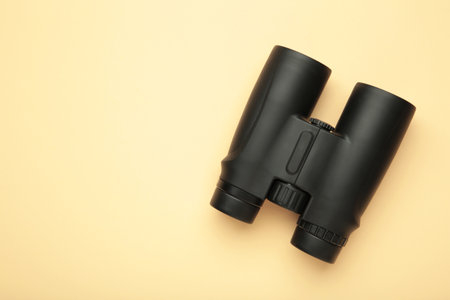 Binoculars on beige background. Top view. Travel conceptの写真素材
