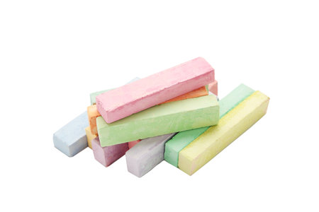 Colored chalks isolated on white background. Top view