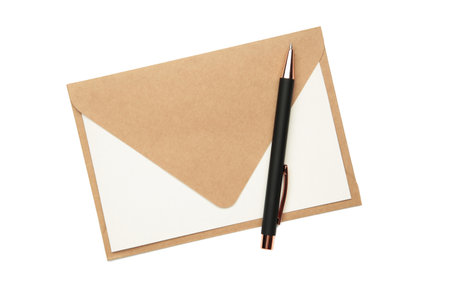 Craft envelope with paper card and pen isolated on white. Top viewの写真素材