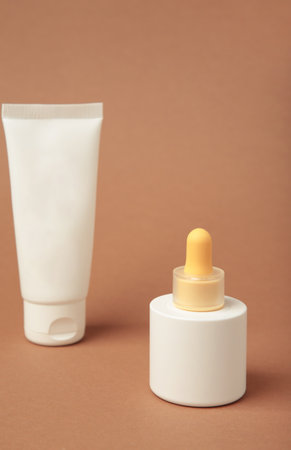 Set of various cosmetic products in blank packaging, creams in jars, serum in bottle on brown background. Top viewの写真素材