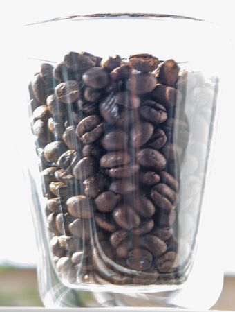 roasted coffee beans in a glass for breakfastの写真素材