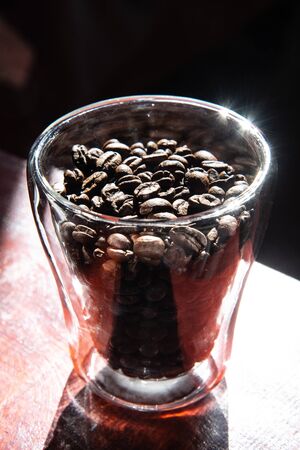 roasted coffee beans in a glass for breakfastの写真素材