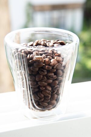 roasted coffee beans in a glass for breakfastの写真素材