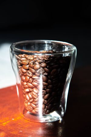 roasted coffee beans in a glass for breakfastの写真素材