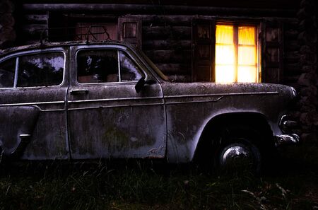 A car parked on the side of a buildingの写真素材