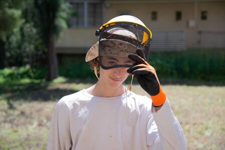 Mow the grass. Gardening, spring cleaning. Garden and grass care.の写真素材