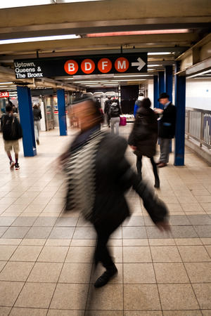 People rushing in a subway station in NYCのeditorial素材