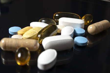Pills on black backgroundvの写真素材