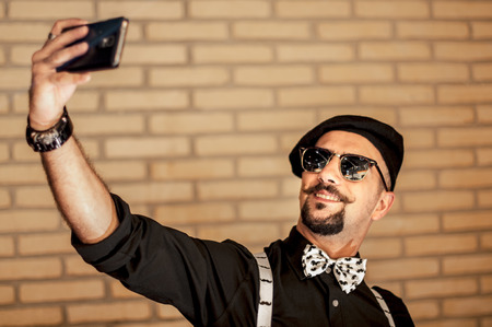 Young man taking a selfieの写真素材