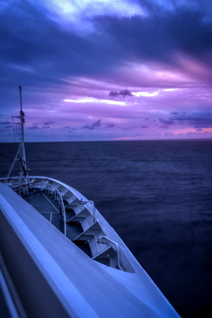 Cruise ship sailling into the horizonの写真素材