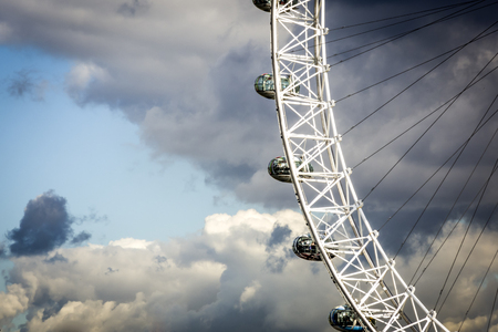 Close-up on London Eye, the gigantic Ferris wheel on Themes in London, on a cloudy dayのeditorial素材