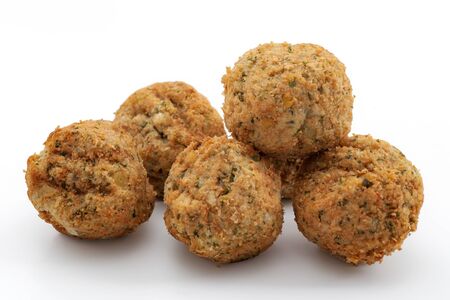 Vegan ethnic food and vegetarian nutrition concept with falafel balls isolated on white background...