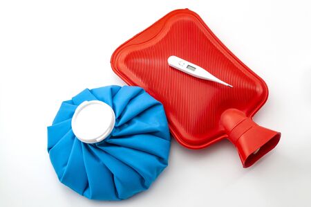 Influenza or flu traditional remedies conceptual idea with blue ice pack, red rubber hot water...