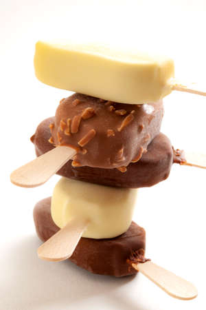 Cold dessert and frozen snack on white