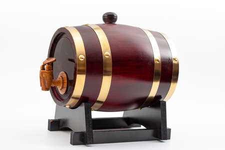 Traditional way of aging spirits, alcoholic beverage distillery or beer on drat concept with wooden barrel with metal bands or straps isolated on white background with clipping path cutoutの写真素材