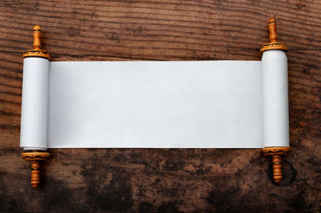Ancient manuscript, holy religious text and vintage memo concept with rolled blank parchment...