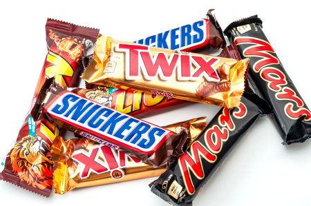 Croydon,UK - January 25, 2020: Illustrative editorial of mixed chocolate candy bars still in wrapper (Snickers, Mars, Lion and Twix) isolated on white backgroundのeditorial素材