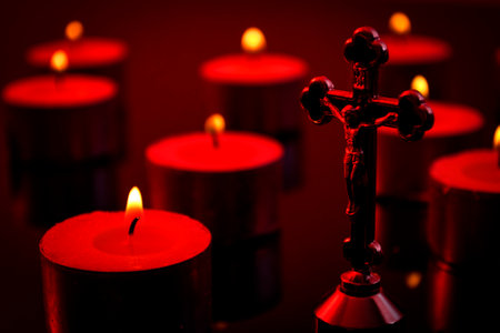 Christianity, faith and religious belief concept with a candlelight scene of a crucifix representing...