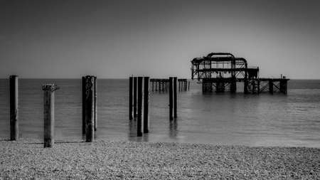 Remains of the west pier in the Brighton, the old pier built in 1866 and burned down back in 1975 in England, UK in black and whiteの写真素材