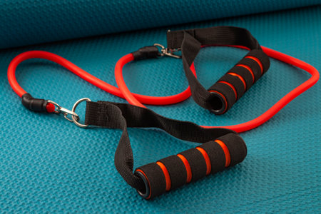 Home gym and strength training concept with rubber resistance bands on yoga matの写真素材