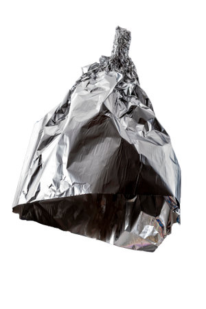 Conspiracy theories, mad pseudoscience and humorous joke concept with tin foil hat isolated on white background with clipping path cutout using ghost mannequin techniqueの写真素材