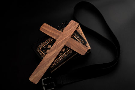 Spare the rod, spoil the child, lost innocence and children abuse concept with religious wood cross,...