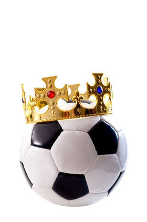 Football is the king of sports, championship winner and league champion concept with a soccer ball wearing a golden crown isolated on white background with a clip path cutoutの写真素材