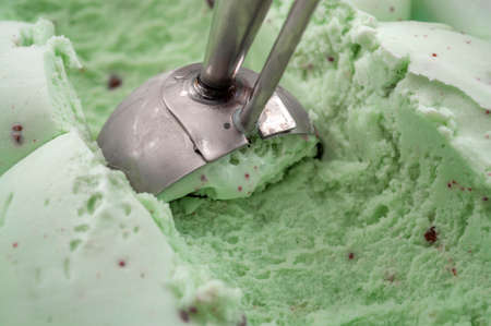 Sugar addiction, insulin resistance, unhealthy diet and November 14 is diabetes awareness day concept with a puppet drowning in sugar cubes isolated on white background and copy space for textの写真素材