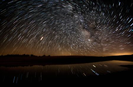 reflections of stars on the lakeの写真素材