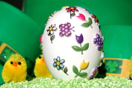 Easter egg on green background.