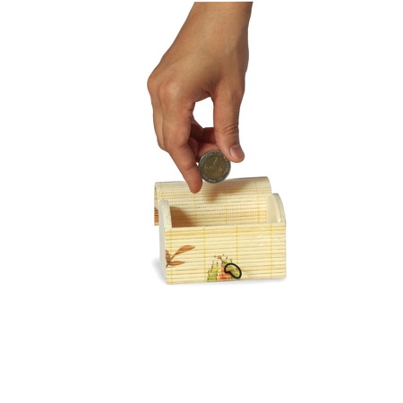 Select focus,Female hand putting a coin into chest bank, isolated on white backgroundの写真素材