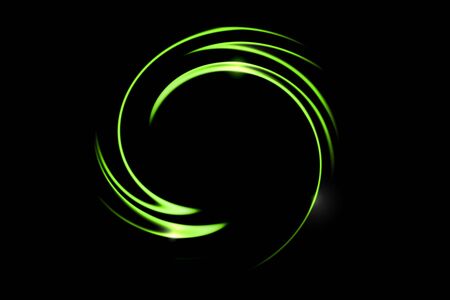 Green fire comet light flying in circle. Shining lights in motion with particles on black sky. Ring of fire, abstract backgroundの写真素材