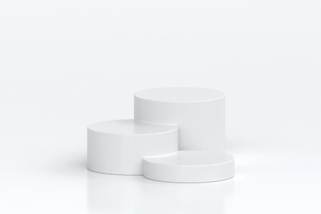 Three white cylindrical podiums of varying heights arranged in minimalist style, set on clean white...