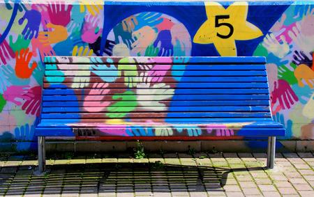 Colored hands on the benchの写真素材