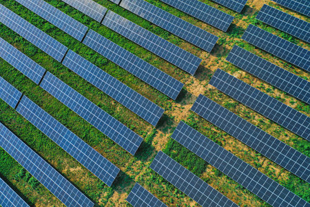 A top-down aerial view of rows of solar panels providing green energy with modern technology...