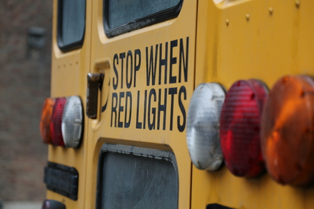 Stop lights yellow school busの写真素材