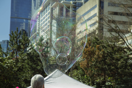 City park people big soap bubbleの写真素材