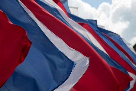 Russian flags clouds blue sky