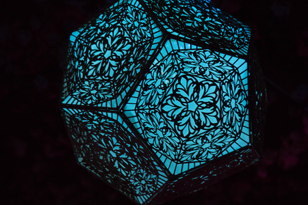 Purple traditional chinese lantern closeup black backgroundの写真素材