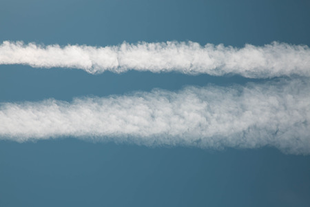Close up blue sky lines left by airplane  の写真素材