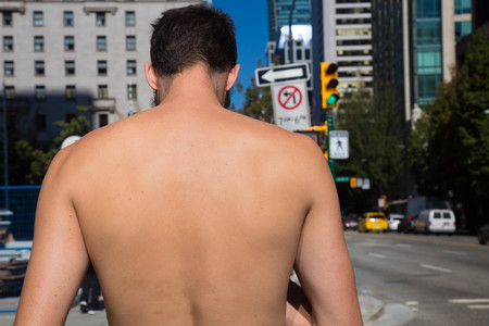 Topless man sunny day street Vancouver Canadaの写真素材