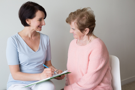 Elderly female answering questions hand writingの写真素材