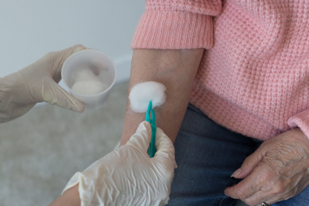 Closeup hands medical gloves nurse patientの写真素材