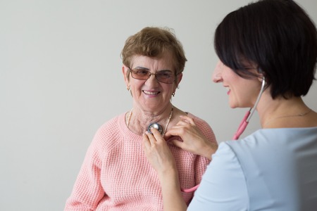 Health care nurse  caregiver elderly  female patient  portraitの写真素材
