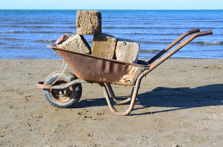 Wheelbarrow for housekeeping and construction work,on site.Cart.Trolley with one wheelの写真素材