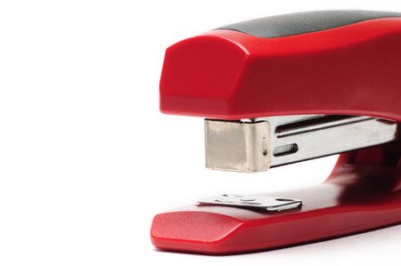 Red office stapler on an isolated white backgroundの写真素材