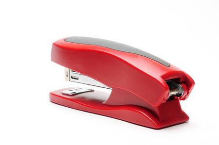 Red office stapler on an isolated white backgroundの写真素材