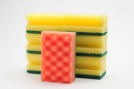 Sponge for washing dishes and plumbing on an isolated white background