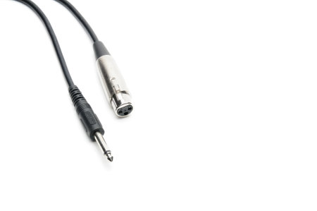 Audio cable with XLR and TRS jack connectors for microphones and professional audio equipment on an isolated white backgroundの写真素材